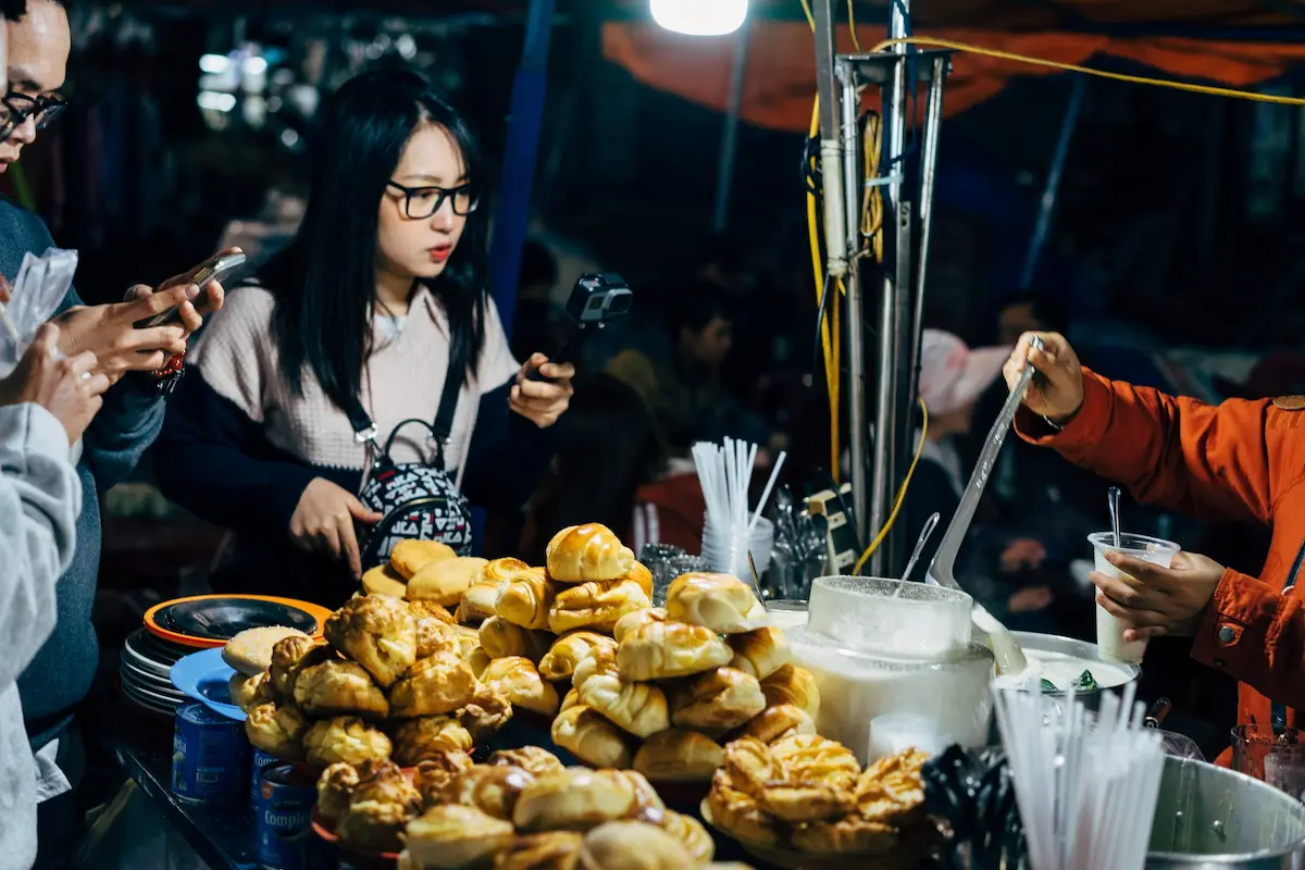 People looking at street food somewhere in Europe