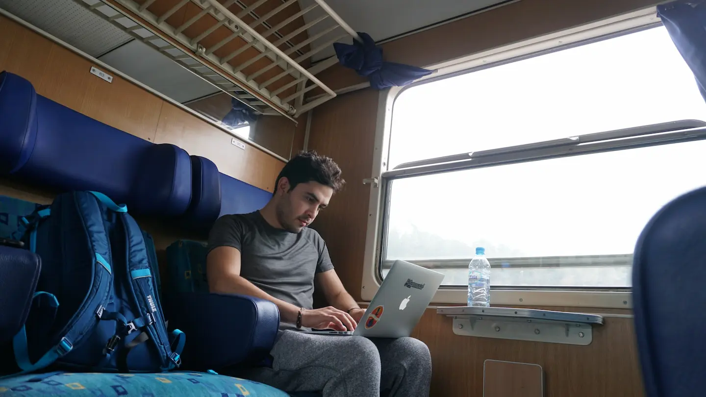 Men in the train connected to the internet.